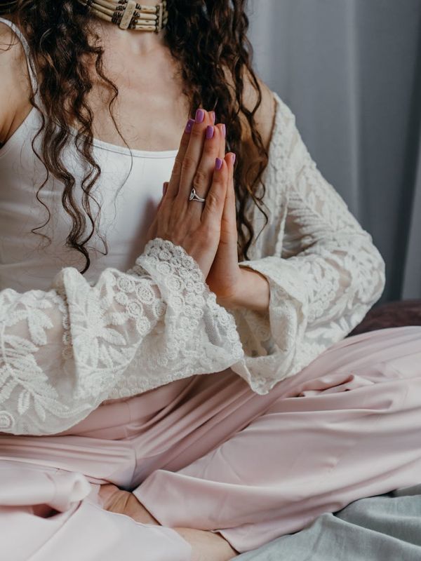Serene woman in a seated meditation pose.