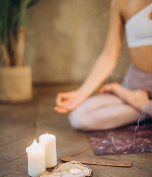 Woman meditating in a peaceful yoga pose, glowing with inner calm.